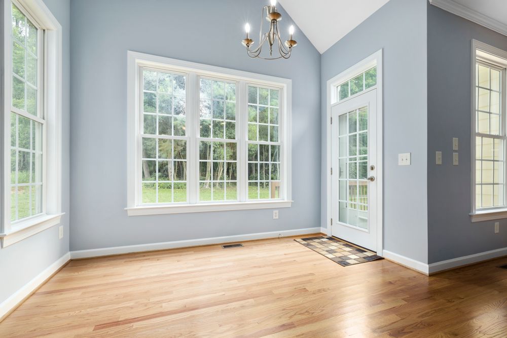 A bright Capitol Hill room with light oak flooring.