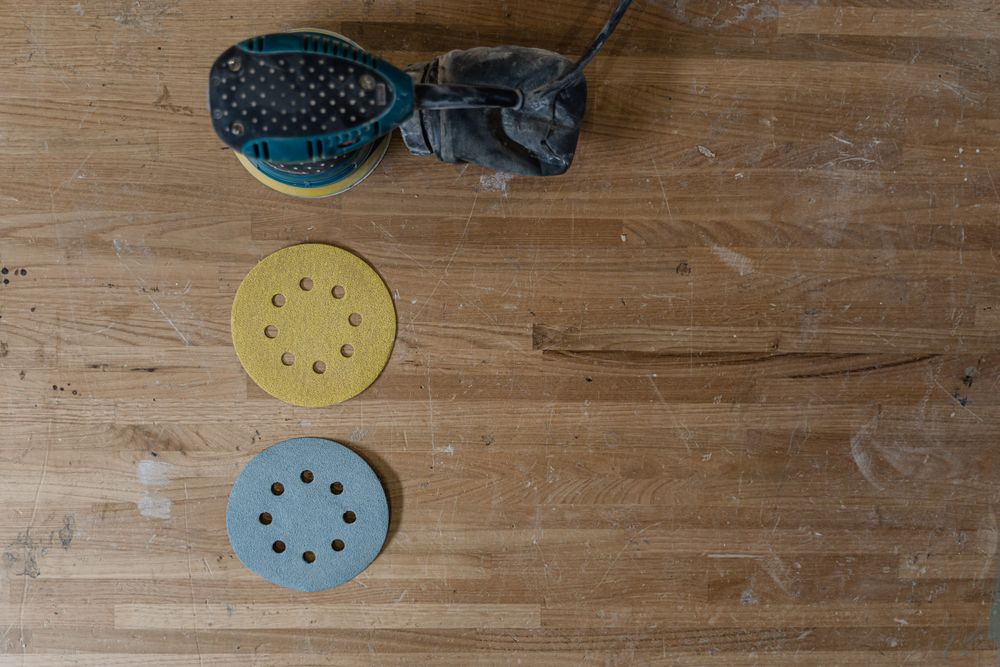 Repair work on a damaged oak floorboard.